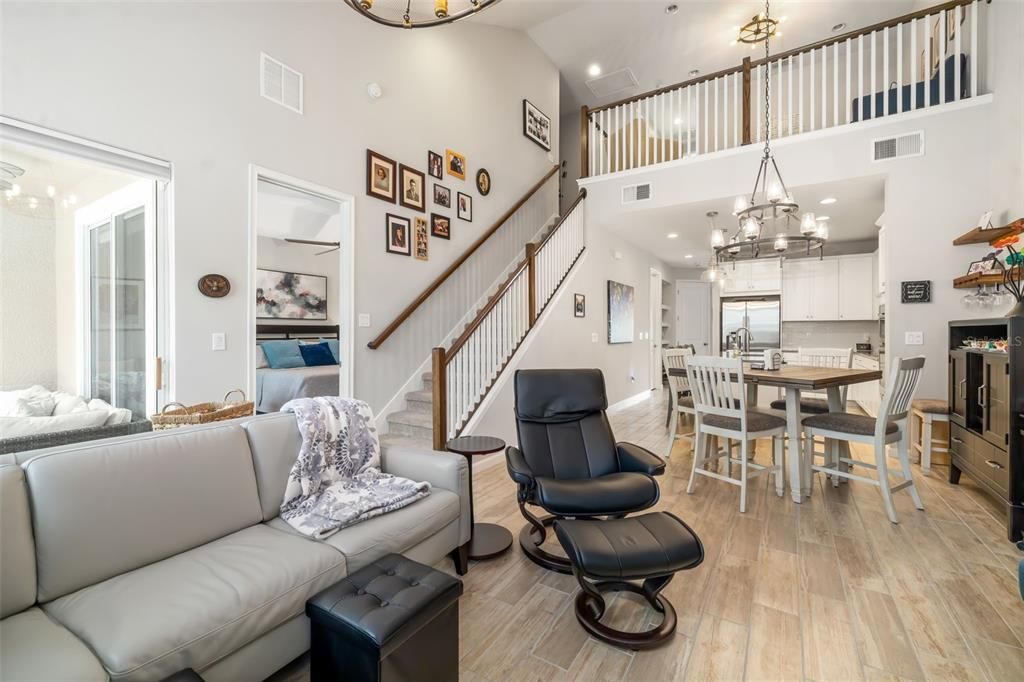 Chandelier, Dining room, Interior, Kitchen, Living room, Recessed Lighting, Stainless Steel Appliances, Wood Texture Flooring