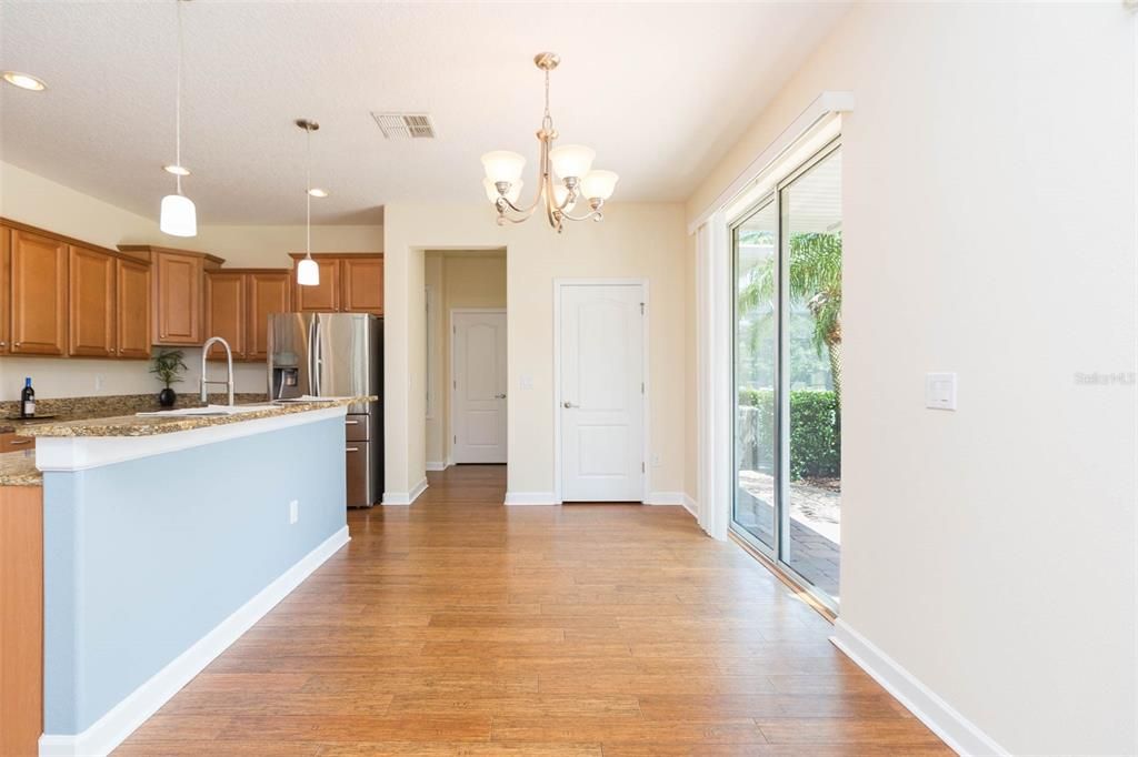 Chandelier, Interior, Kitchen, Pendant Lights, Recessed Lighting, Stainless Steel Appliances, Wood Texture Flooring