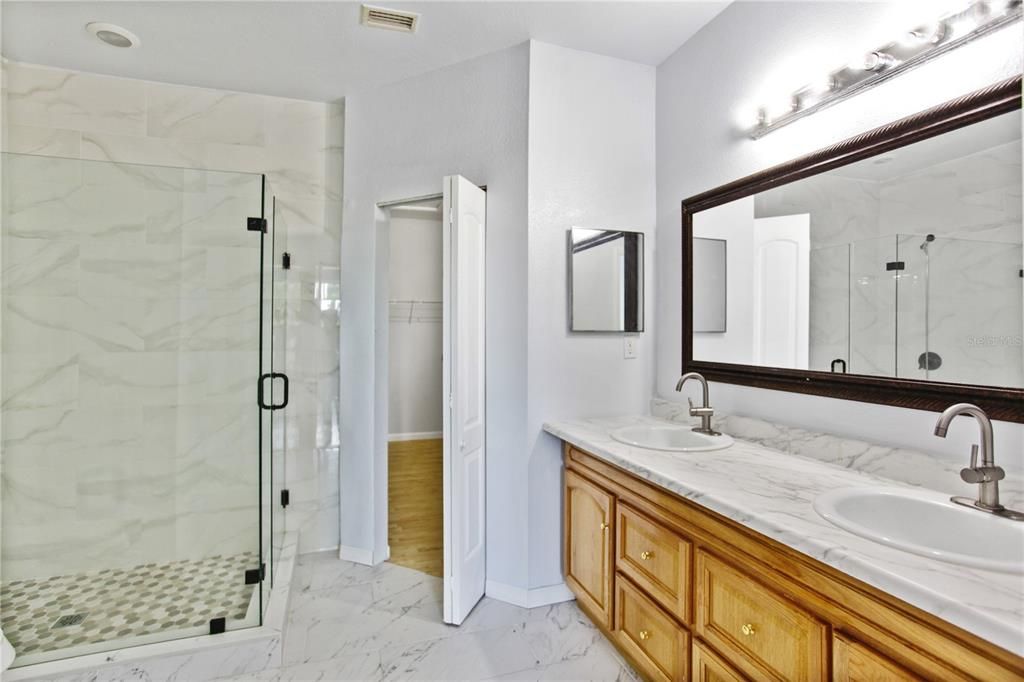 Bathroom, Dual Sink Vanities, Glass Shower, Interior, Marble, Marble Walls, Tile Countertops