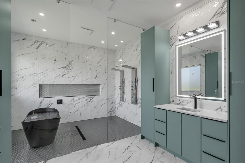 Bathroom, Dual Sink Vanities, Glass Shower, Interior, Marble, Marble Walls, Recessed Lighting