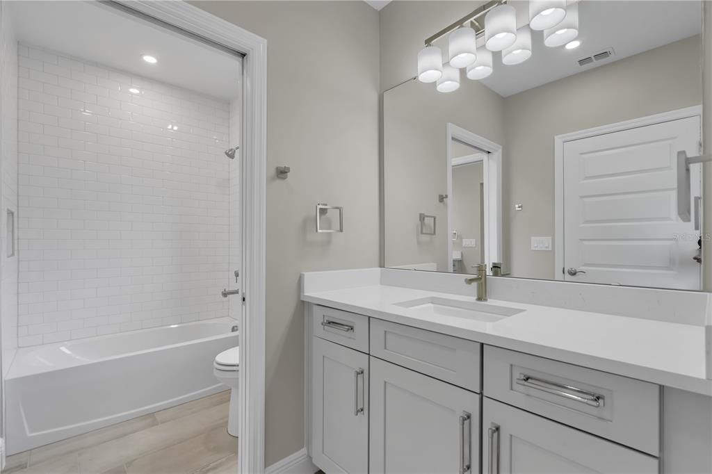 Bathroom, Dual Sink Vanities, Interior, Recessed Lighting, Wood Texture Flooring