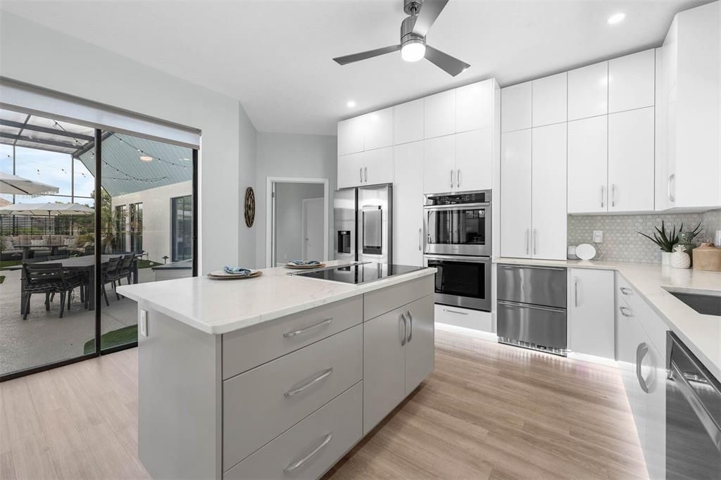 Dining room, Interior, Kitchen, Recessed Lighting, Stainless Steel Appliances, Wood Texture Flooring