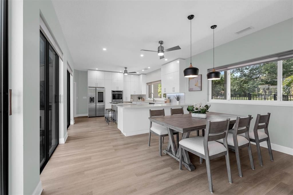 Dining room, Interior, Kitchen, Pendant Lights, Recessed Lighting, Stainless Steel Appliances, Wood Texture Flooring