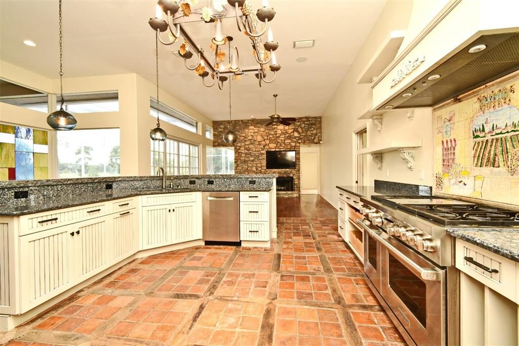 Fireplace, Interior, Kitchen, Pendant Lights, Recessed Lighting, Stainless Steel Appliances, Stone Walls