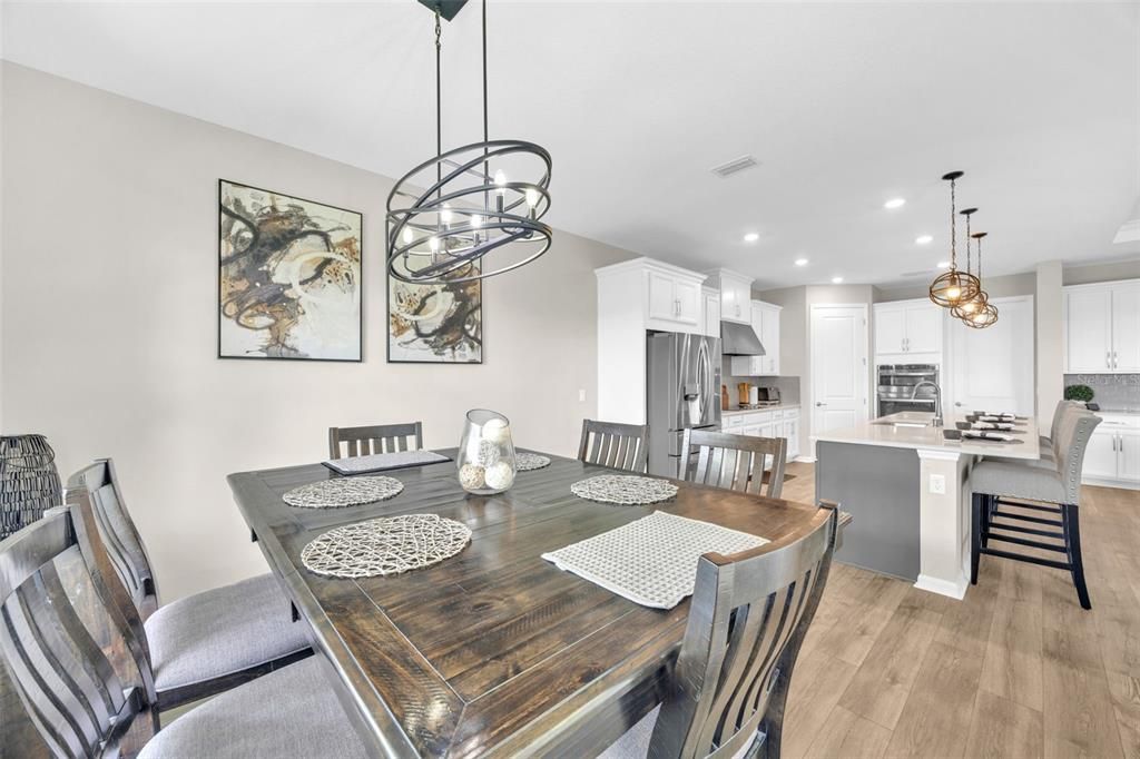 Dining room, Interior, Kitchen, Pendant Lights, Recessed Lighting, Stainless Steel Appliances, Wood Texture Flooring