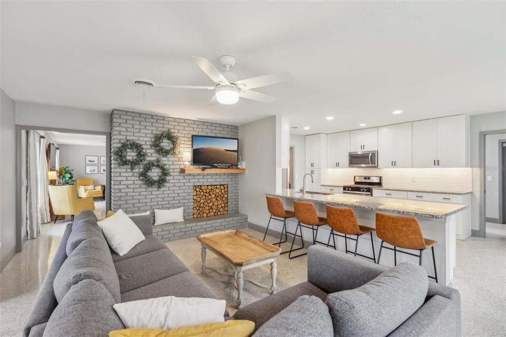 Fireplace, Interior, Kitchen, Living room, Recessed Lighting, Stainless Steel Appliances, Stone Walls