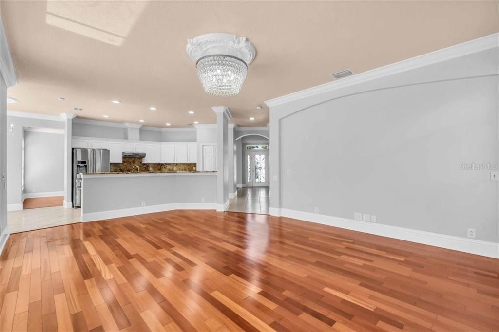 Chandelier, Empty room, Interior, Kitchen, Recessed Lighting, Stainless Steel Appliances, Wood Texture Flooring