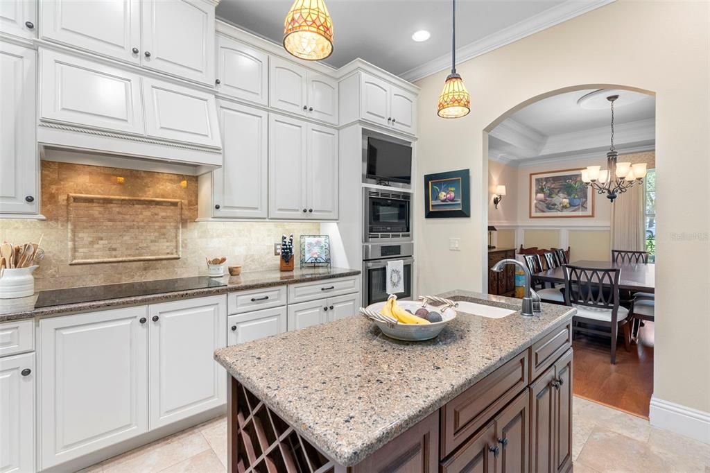 Chandelier, Dining room, Interior, Kitchen, Pendant Lights, Recessed Lighting, Stainless Steel Appliances, Wood Texture Flooring