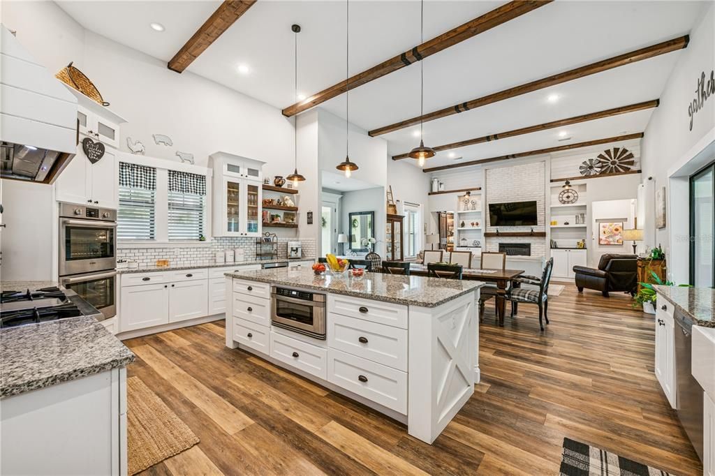 Dining room, Interior, Kitchen, Pendant Lights, Recessed Lighting, Stainless Steel Appliances, Wooden Beams, Wood Texture Flooring