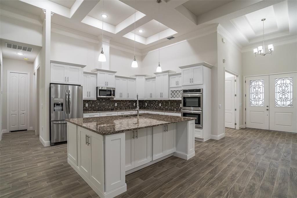 Chandelier, Interior, Kitchen, Pendant Lights, Recessed Lighting, Stainless Steel Appliances, Wood Texture Flooring