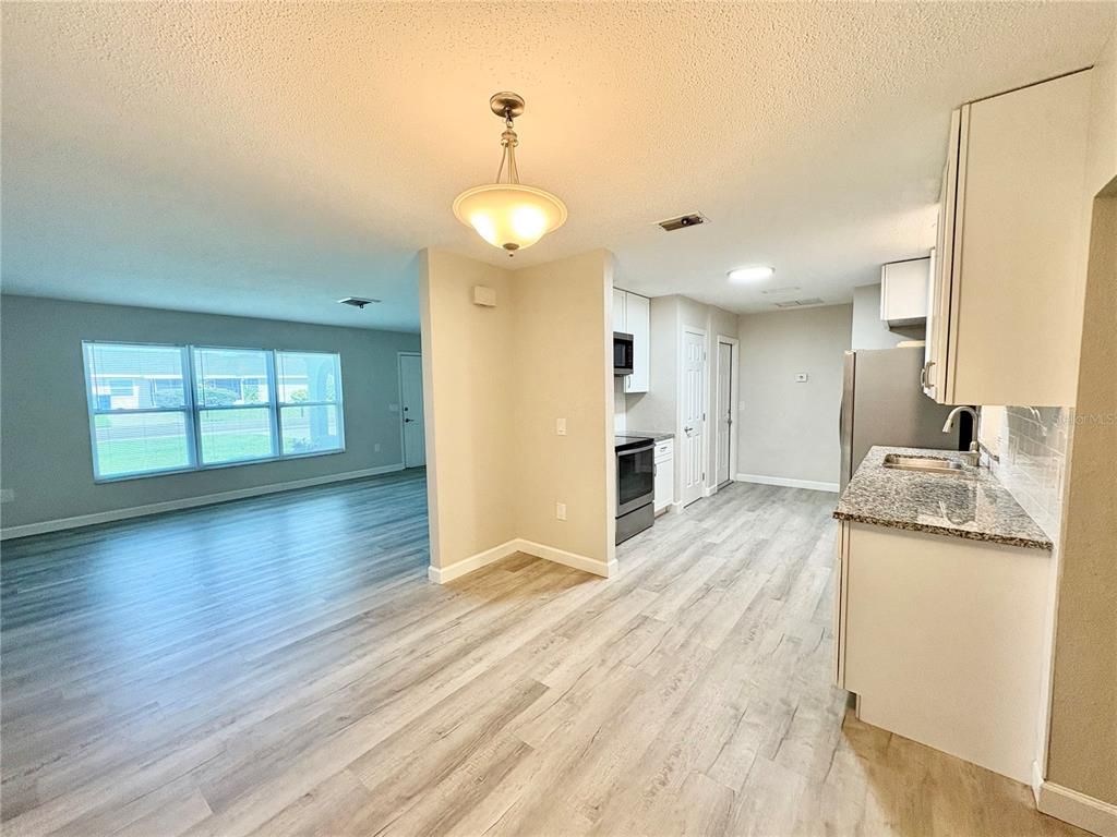 Empty room, Interior, Kitchen, Pendant Lights, Recessed Lighting, Wood Texture Flooring