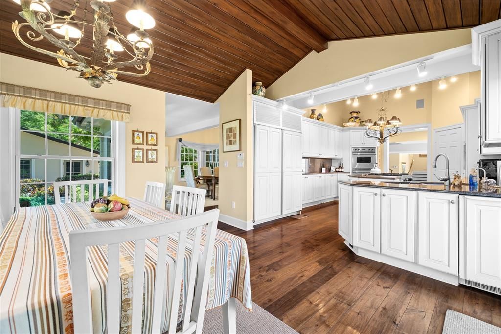 Chandelier, Dining room, Interior, Kitchen, Stainless Steel Appliances, Wooden Ceilings, Wood Texture Flooring