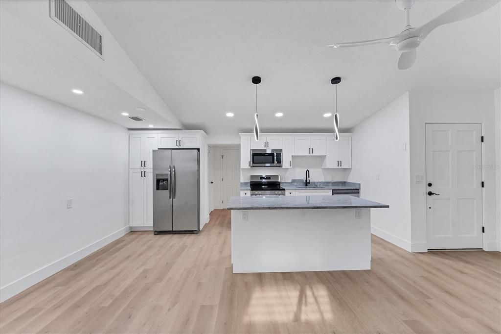 Interior, Kitchen, Pendant Lights, Recessed Lighting, Stainless Steel Appliances, Wood Texture Flooring