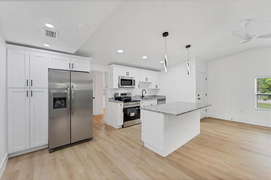 Interior, Kitchen, Pendant Lights, Recessed Lighting, Stainless Steel Appliances, Wood Texture Flooring
