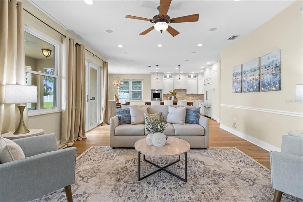 Chandelier, Dining room, Interior, Kitchen, Living room, Pendant Lights, Recessed Lighting, Stainless Steel Appliances, Wood Texture Flooring