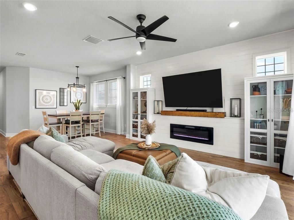 Dining room, Fireplace, Interior, Living room, Pendant Lights, Recessed Lighting, Wood Texture Flooring
