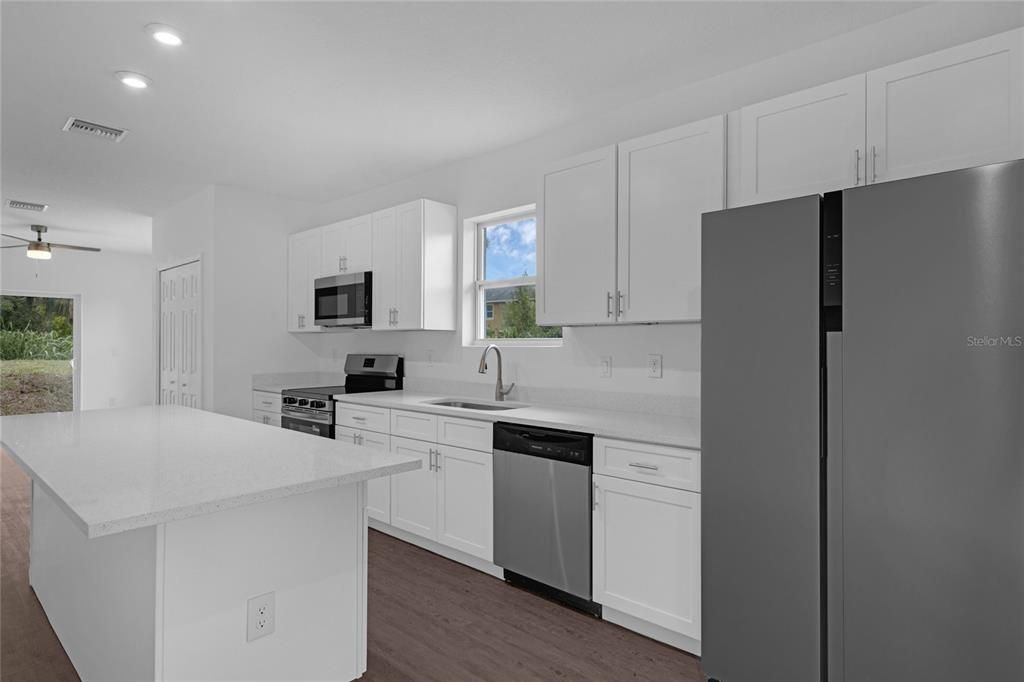 Interior, Kitchen, Recessed Lighting, Stainless Steel Appliances, Wood Texture Flooring
