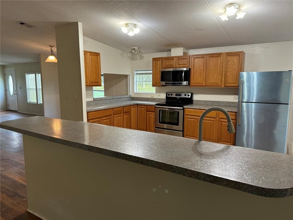 Interior, Kitchen, Pendant Lights, Stainless Steel Appliances, Wood Texture Flooring