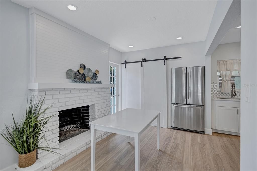 Fireplace, Interior, Kitchen, Recessed Lighting, Stainless Steel Appliances, Wood Texture Flooring