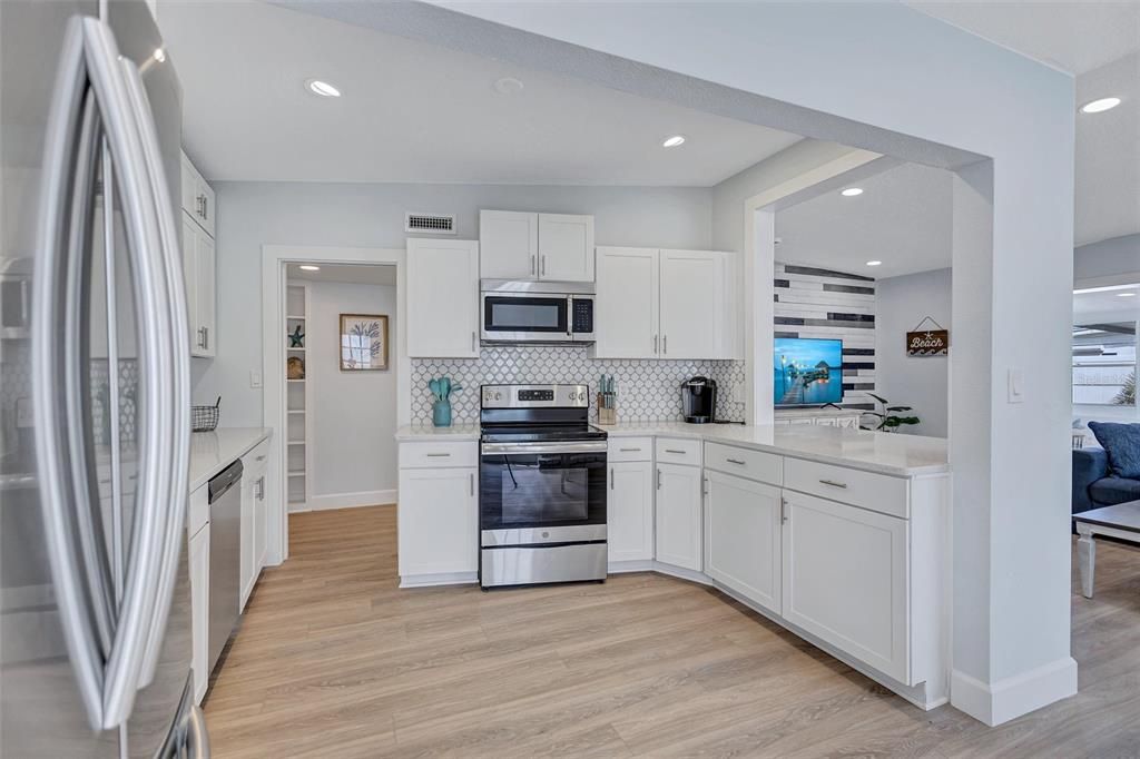 Interior, Kitchen, Recessed Lighting, Stainless Steel Appliances, Wood Texture Flooring