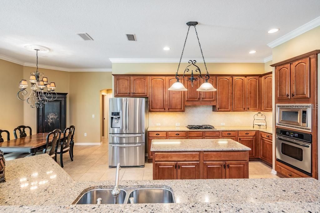 Chandelier, Dining room, Interior, Kitchen, Pendant Lights, Recessed Lighting, Stainless Steel Appliances