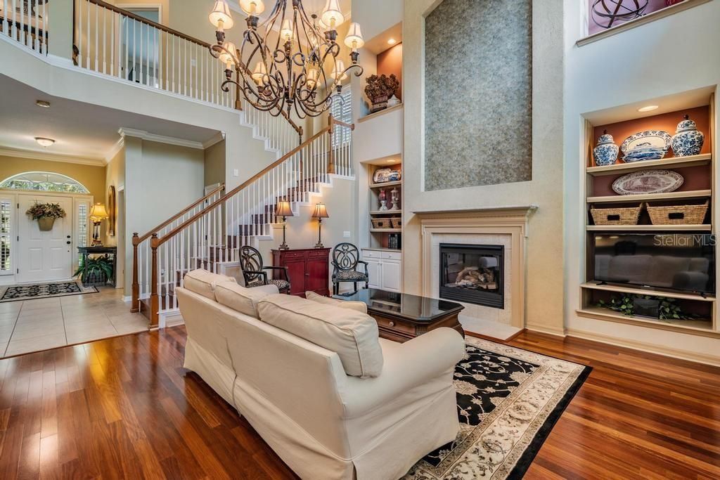 Chandelier, Fireplace, Interior, Living room, Recessed Lighting, Wood Texture Flooring