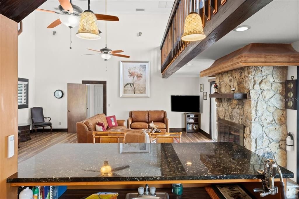 Fireplace, Interior, Living room, Recessed Lighting, Stone Walls, Wood Texture Flooring