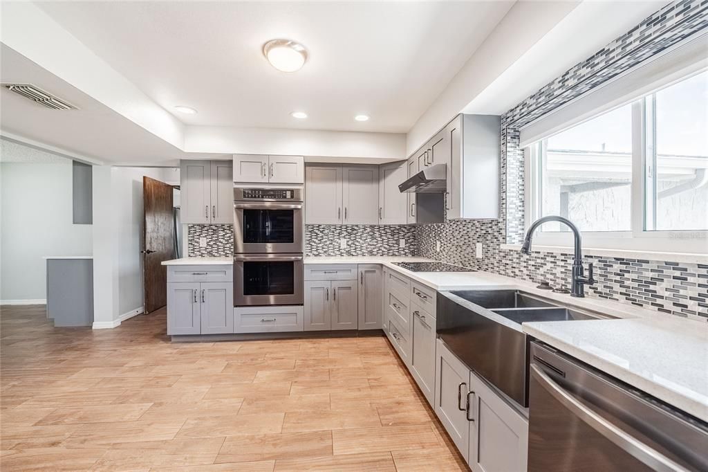 Interior, Kitchen, Recessed Lighting, Stainless Steel Appliances, Wood Texture Flooring