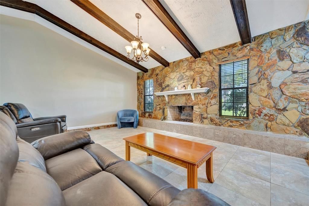 Chandelier, Fireplace, Interior, Living room, Stone Walls, Wooden Beams