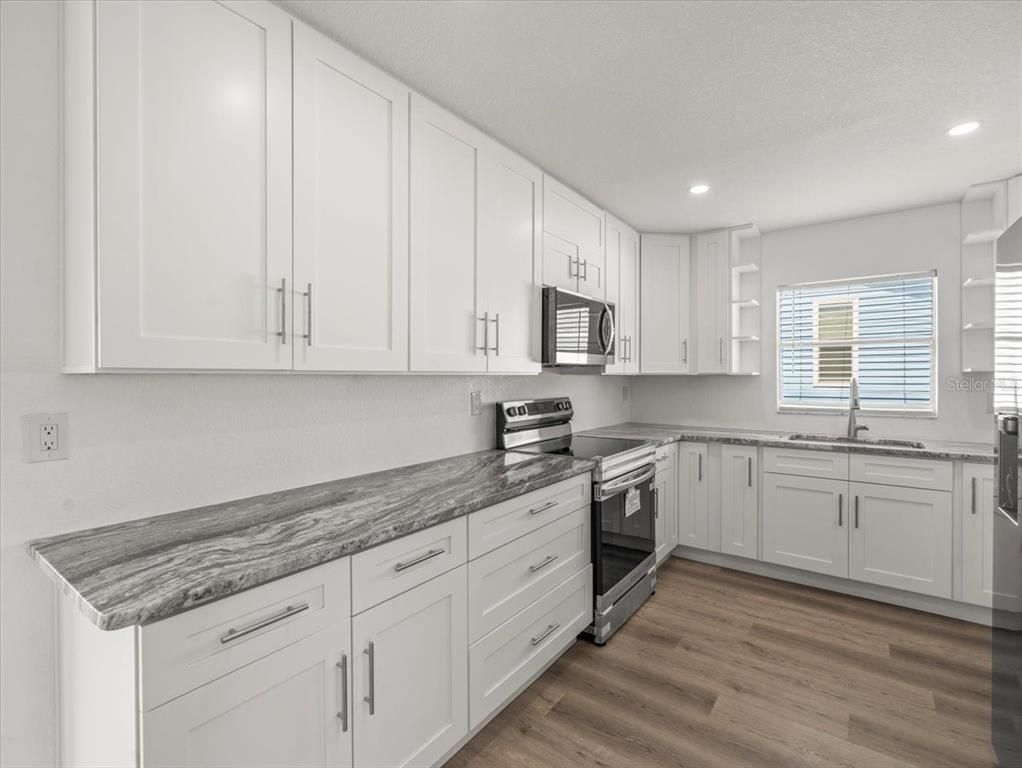 Interior, Kitchen, Recessed Lighting, Stainless Steel Appliances, Wood Texture Flooring