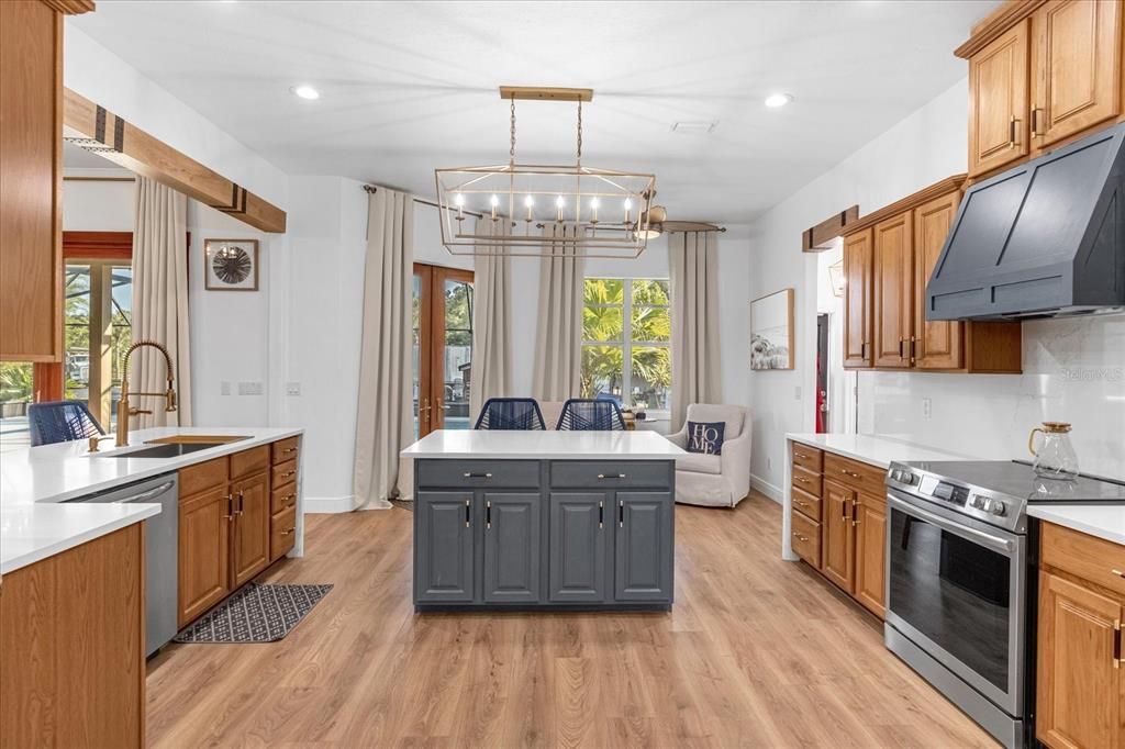 Chandelier, Interior, Kitchen, Pendant Lights, Recessed Lighting, Stainless Steel Appliances, Wood Texture Flooring