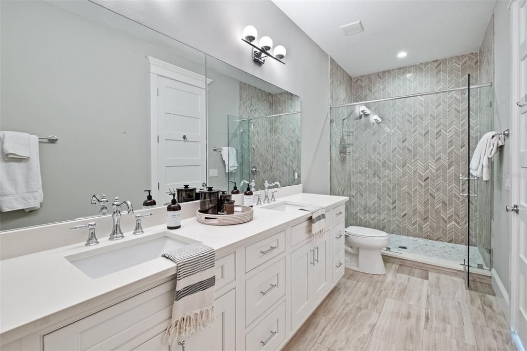 Bathroom, Dual Sink Vanities, Glass Shower, Interior, Recessed Lighting, Wood Texture Flooring