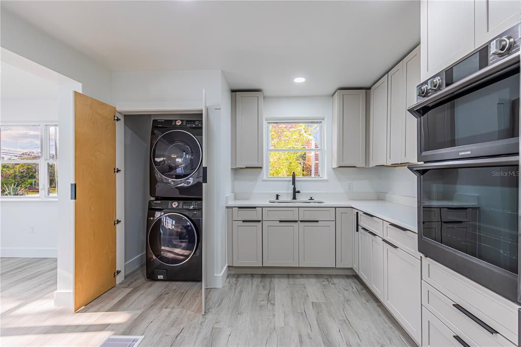 Interior, Kitchen, Recessed Lighting, Washer, Wood Texture Flooring