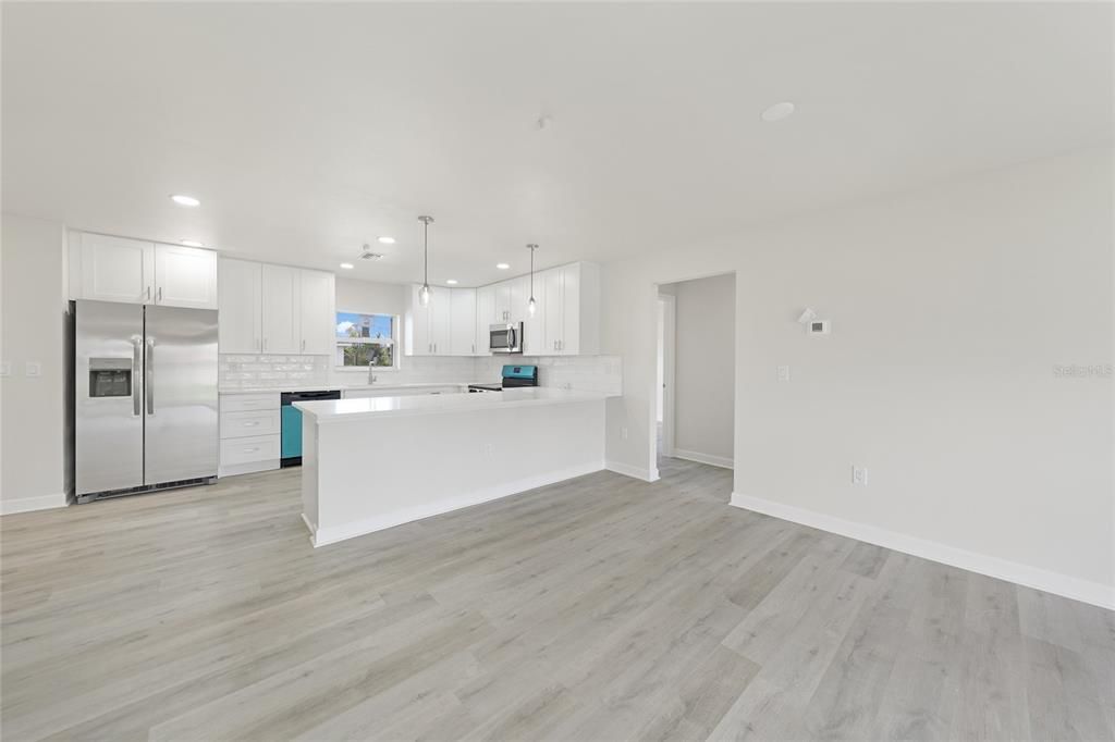 Interior, Kitchen, Pendant Lights, Recessed Lighting, Stainless Steel Appliances, Wood Texture Flooring