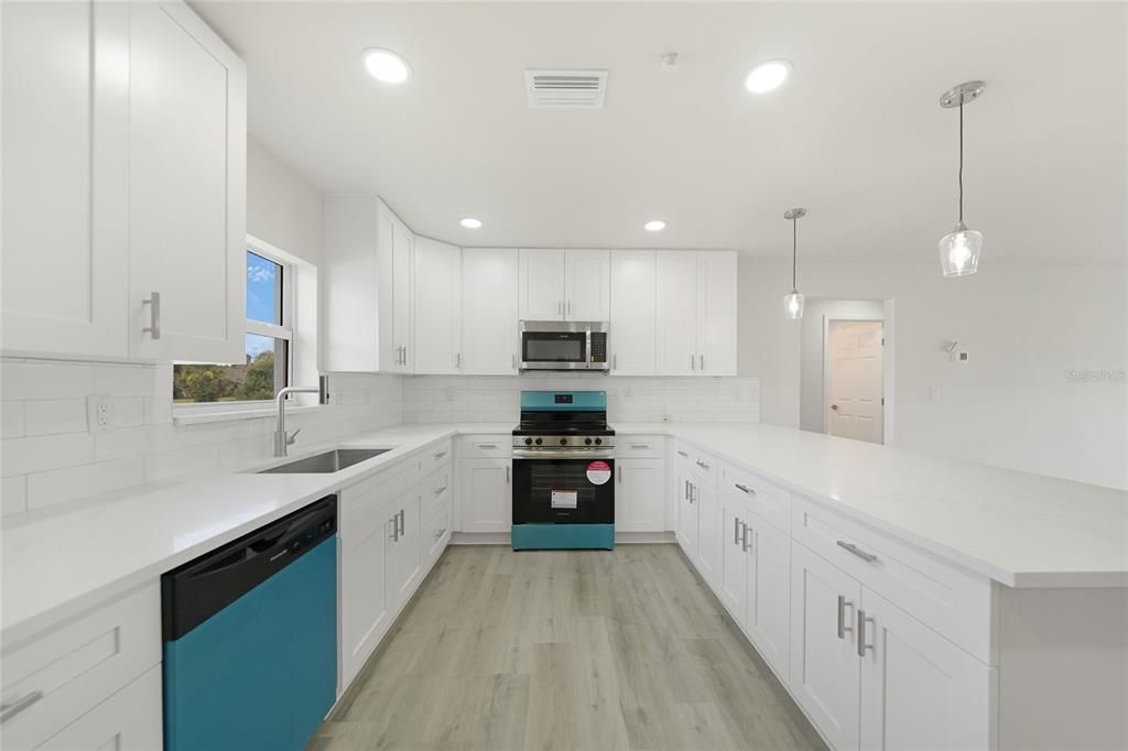 Interior, Kitchen, Pendant Lights, Recessed Lighting, Stainless Steel Appliances, Wood Texture Flooring
