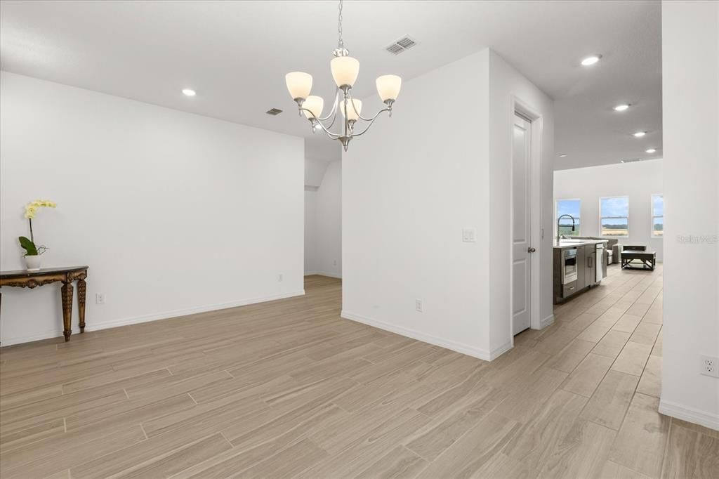 Chandelier, Empty room, Interior, Recessed Lighting, Stainless Steel Appliances, Wood Texture Flooring