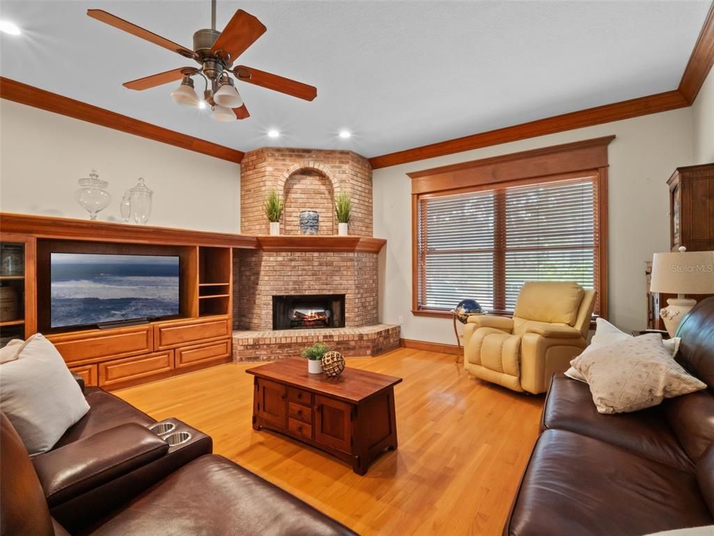 Fireplace, Interior, Living room, Recessed Lighting, Stone Walls, Wood Texture Flooring