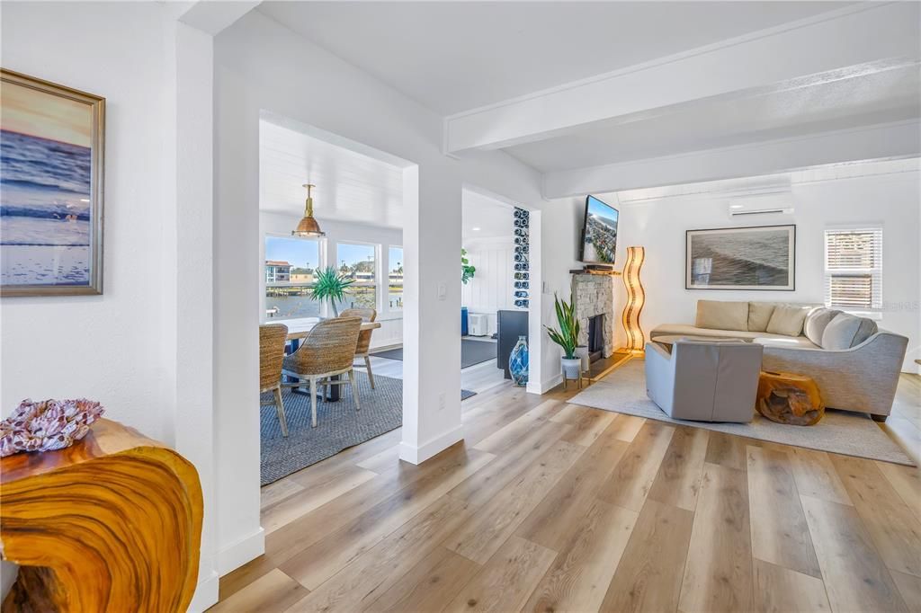 Dining room, Fireplace, Interior, Living room, Pendant Lights, Water, Wood Texture Flooring