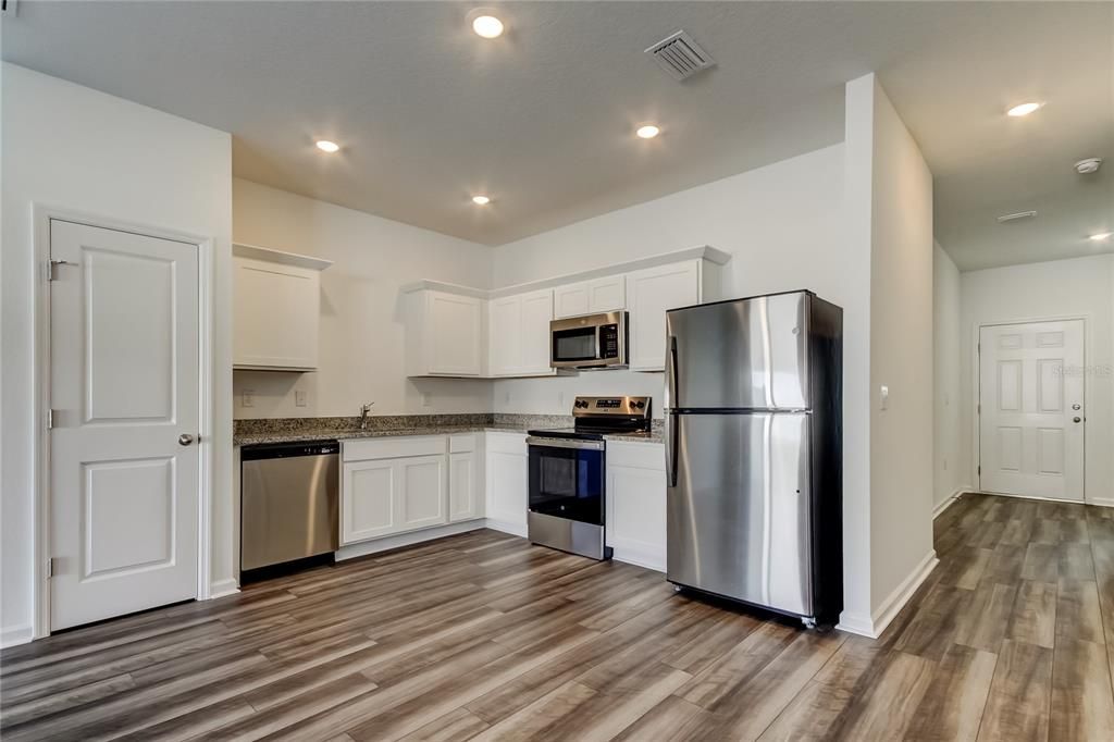 Interior, Kitchen, Recessed Lighting, Stainless Steel Appliances, Wood Texture Flooring