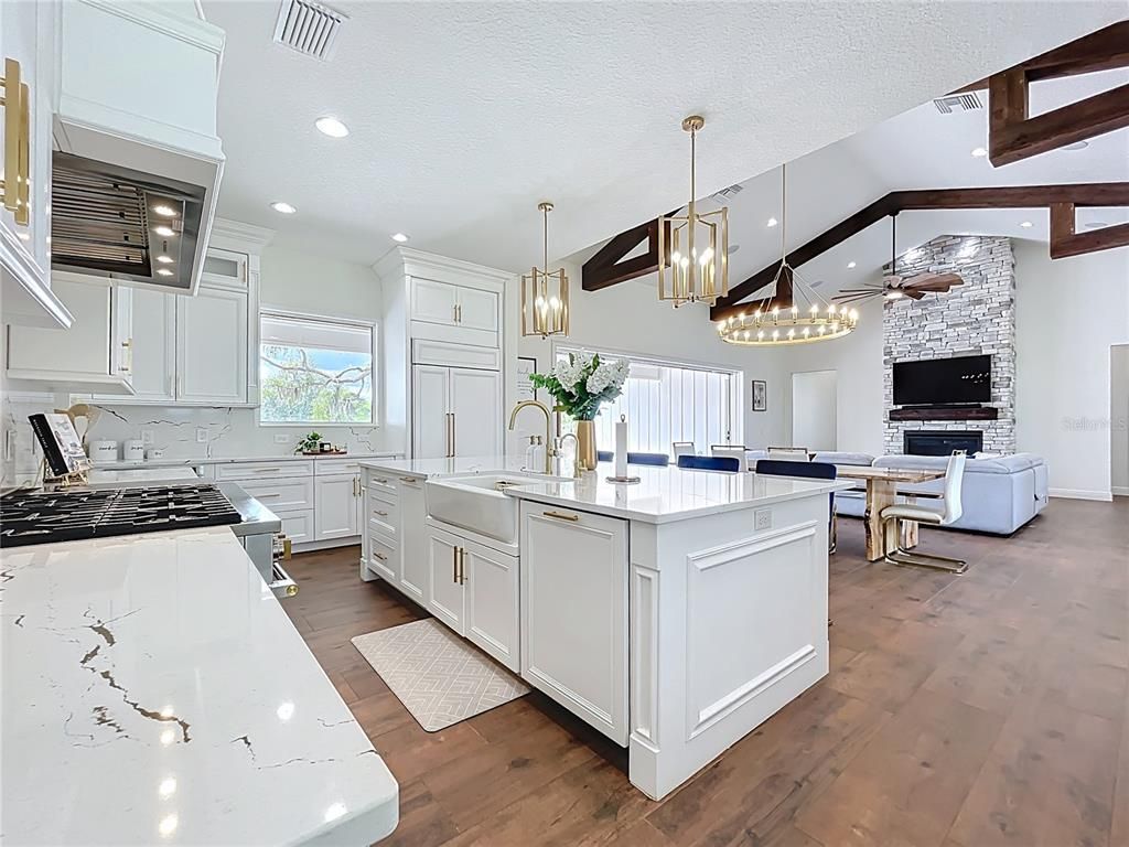 Dining room, Fireplace, Interior, Kitchen, Living room, Pendant Lights, Recessed Lighting, Stainless Steel Appliances, Stone Walls, Wooden Beams, Wood Texture Flooring