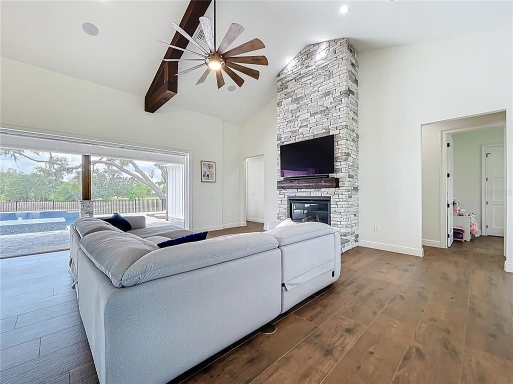 Bedroom, Fireplace, Interior, Recessed Lighting, Stone Walls, Wood Texture Flooring