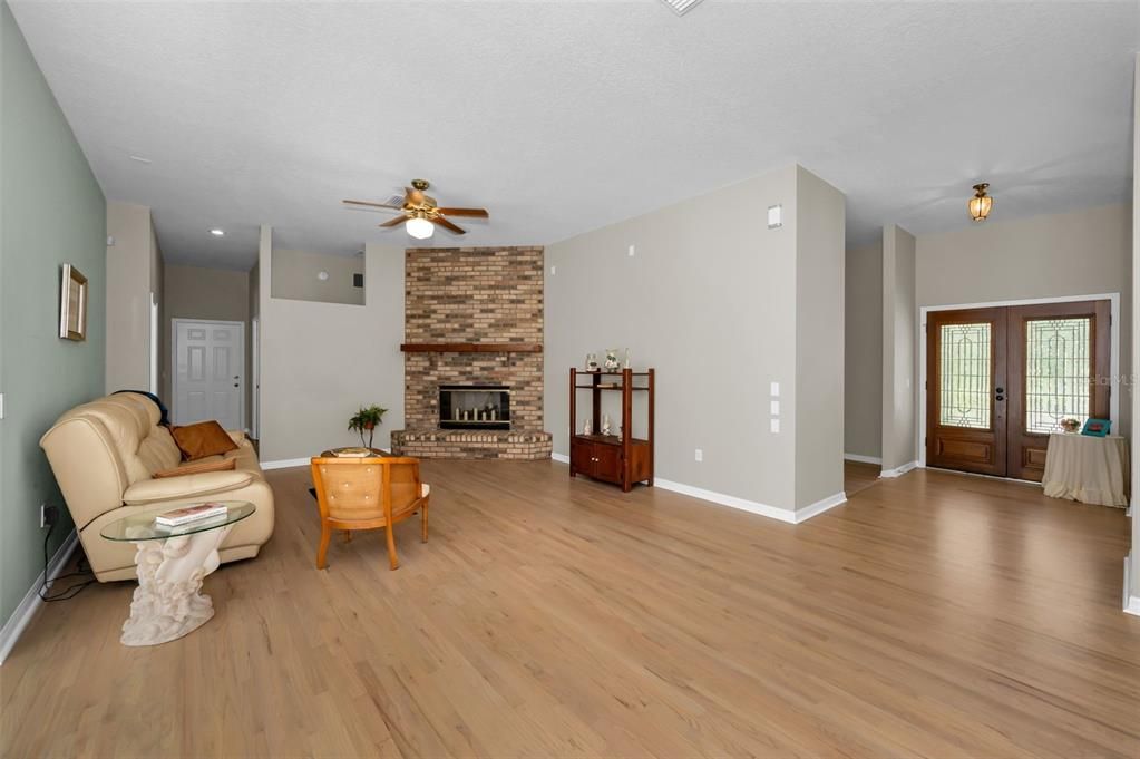 Fireplace, Interior, Living room, Recessed Lighting, Stone Walls, Wood Texture Flooring