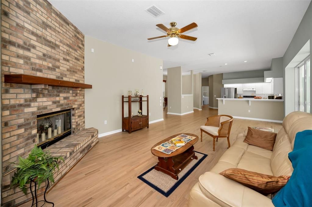 Fireplace, Interior, Kitchen, Living room, Recessed Lighting, Stone Walls, Wood Texture Flooring
