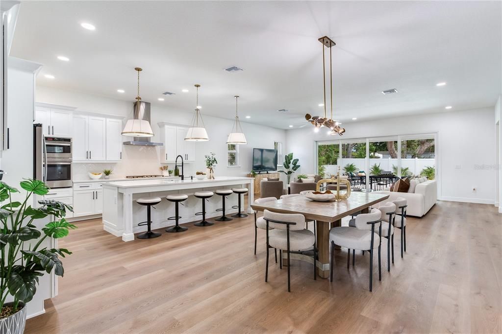 Dining room, Interior, Kitchen, Pendant Lights, Recessed Lighting, Stainless Steel Appliances, Wood Texture Flooring