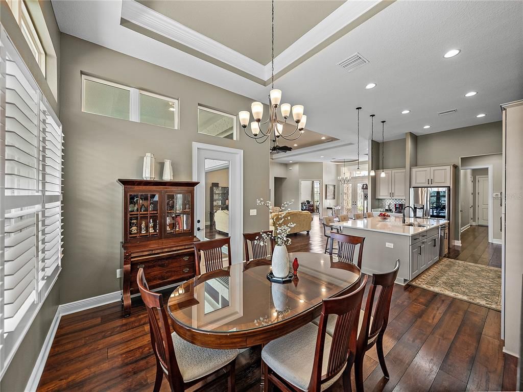 Chandelier, Dining room, Interior, Kitchen, Pendant Lights, Recessed Lighting, Stainless Steel Appliances, Wood Texture Flooring