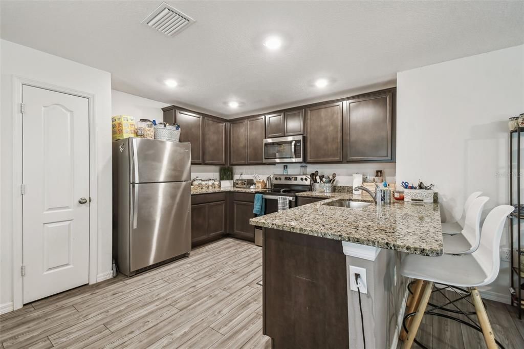 Interior, Kitchen, Recessed Lighting, Stainless Steel Appliances, Wood Texture Flooring