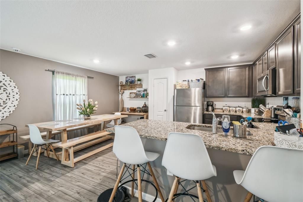 Dining room, Interior, Kitchen, Recessed Lighting, Stainless Steel Appliances, Wood Texture Flooring