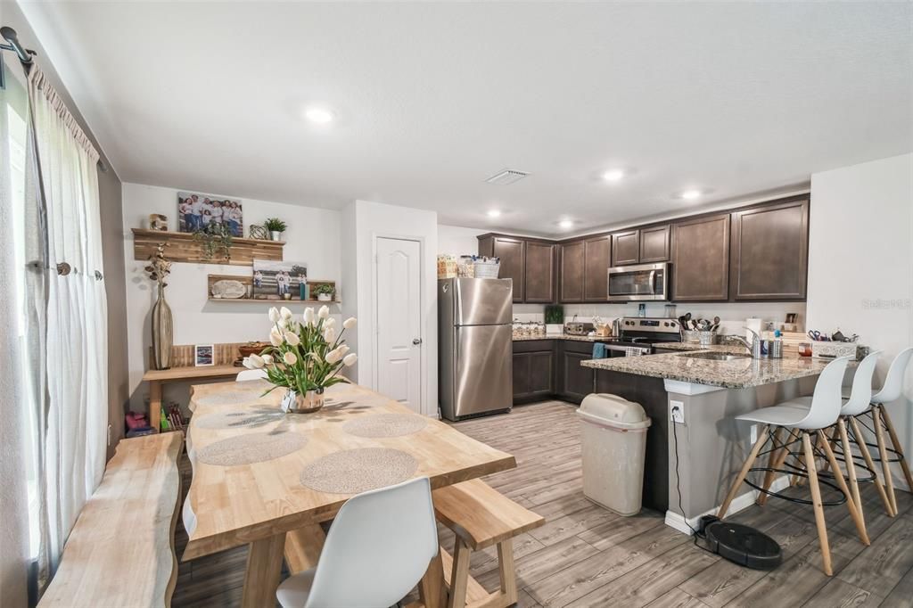 Dining room, Interior, Kitchen, Recessed Lighting, Stainless Steel Appliances, Wood Texture Flooring