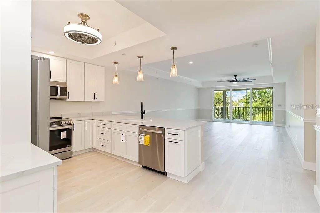 Interior, Kitchen, Pendant Lights, Recessed Lighting, Stainless Steel Appliances, Wood Texture Flooring