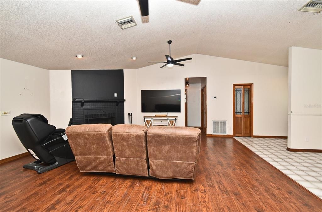 Fireplace, Interior, Living room, Recessed Lighting, Wood Texture Flooring